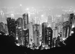 Hong Kong skyline from Peak. Bank of China is building with neon crosses to right of centre. Kowloon in background; 438908 Dave Butcher