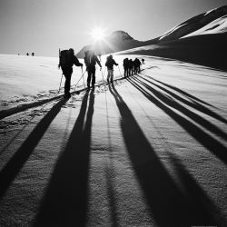 Skiing east as sun rises above mountains south of Eiger and Grindelwald, Switzerland; 122903 Dave Butcher